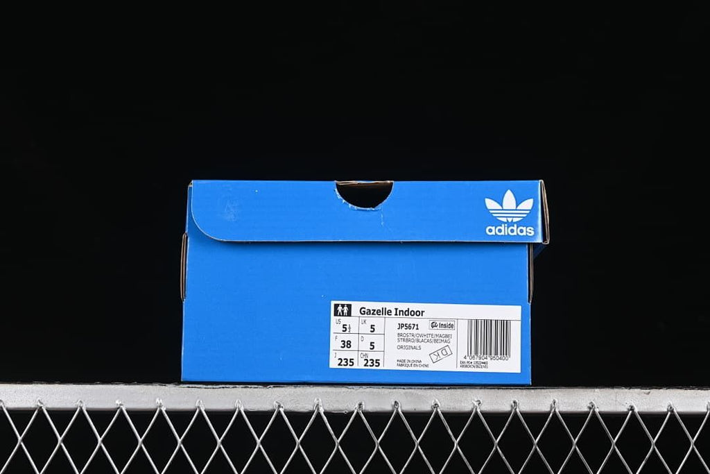 Blue adidas shoe box with a Gazelle Indoor JP5671 label showing the photographed sample size.