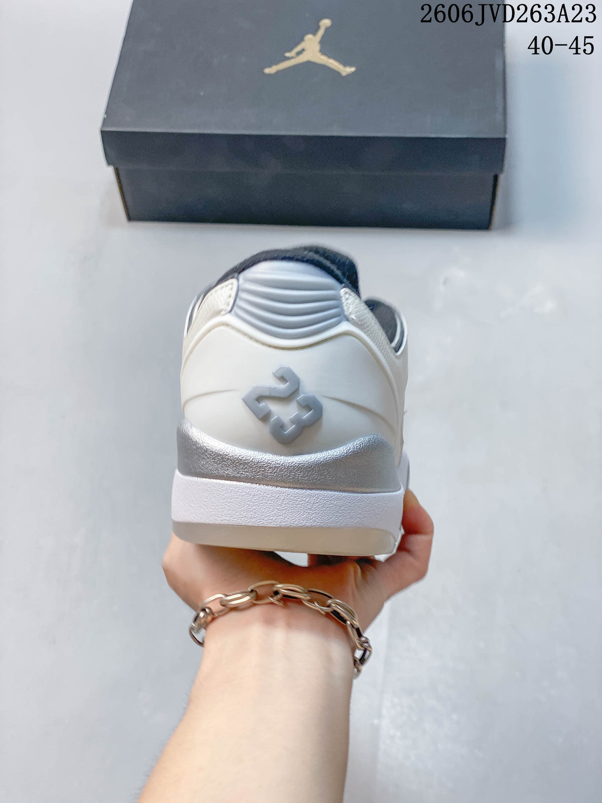 Heel view of the white Jordan Sixty Plus Low sneaker