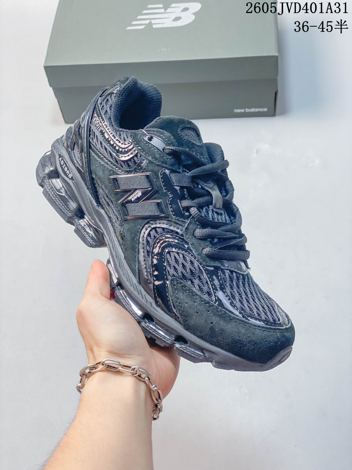 Dark charcoal New Balance 997 sneaker showing the side and sole