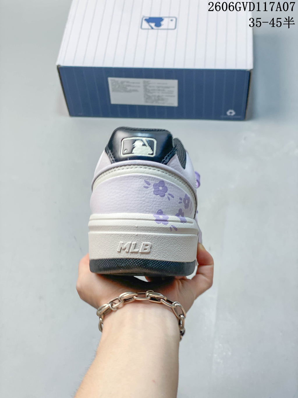 Rear view of the MLB Chunky Liner sneaker showing lavender floral graphics