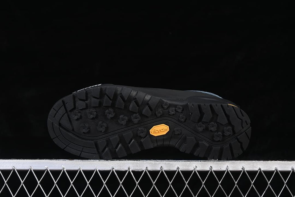 Underside view showing the black tread pattern and Vibram mark.