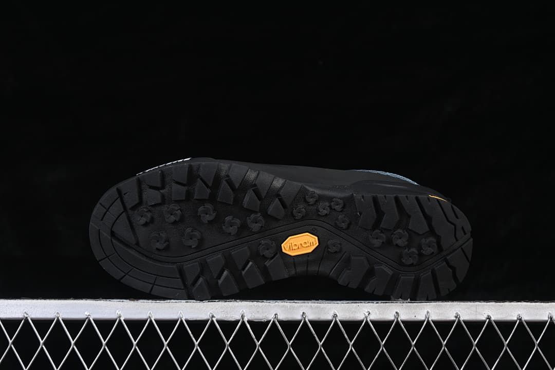 Underside view showing the black tread pattern and Vibram mark.