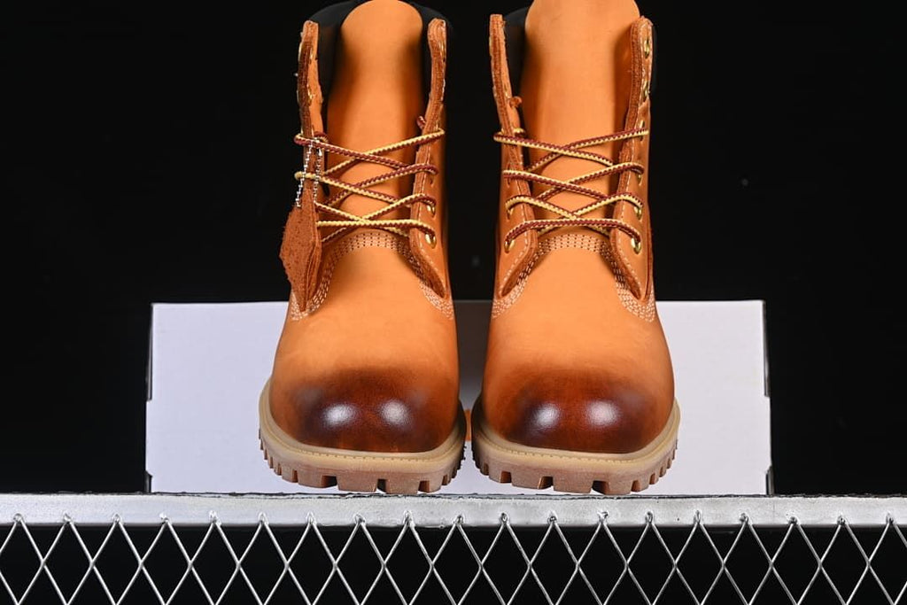 Front view of the pair showing rounded toes and lace-up fronts