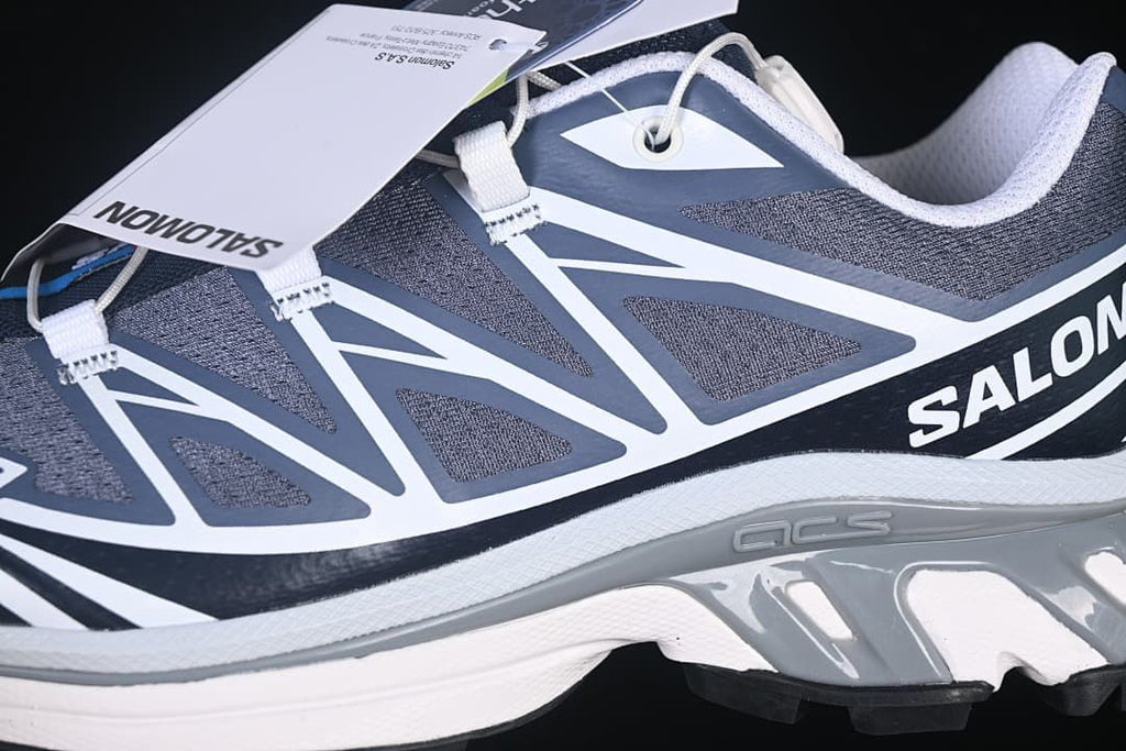 Side detail of the shoe's upper, lace system, and midsole
