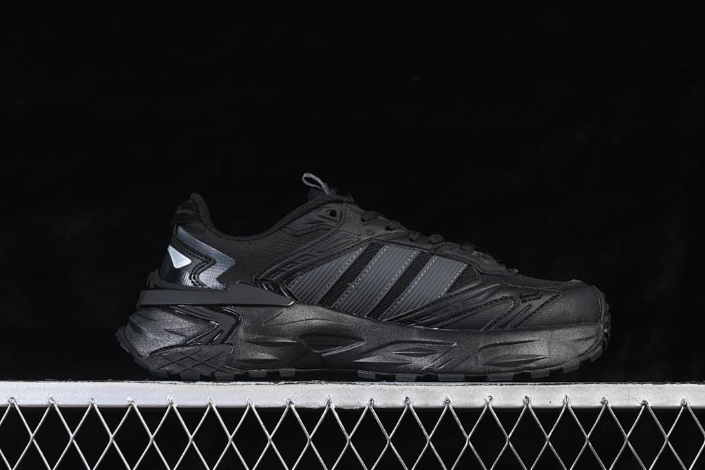 Side profile of the black sneaker