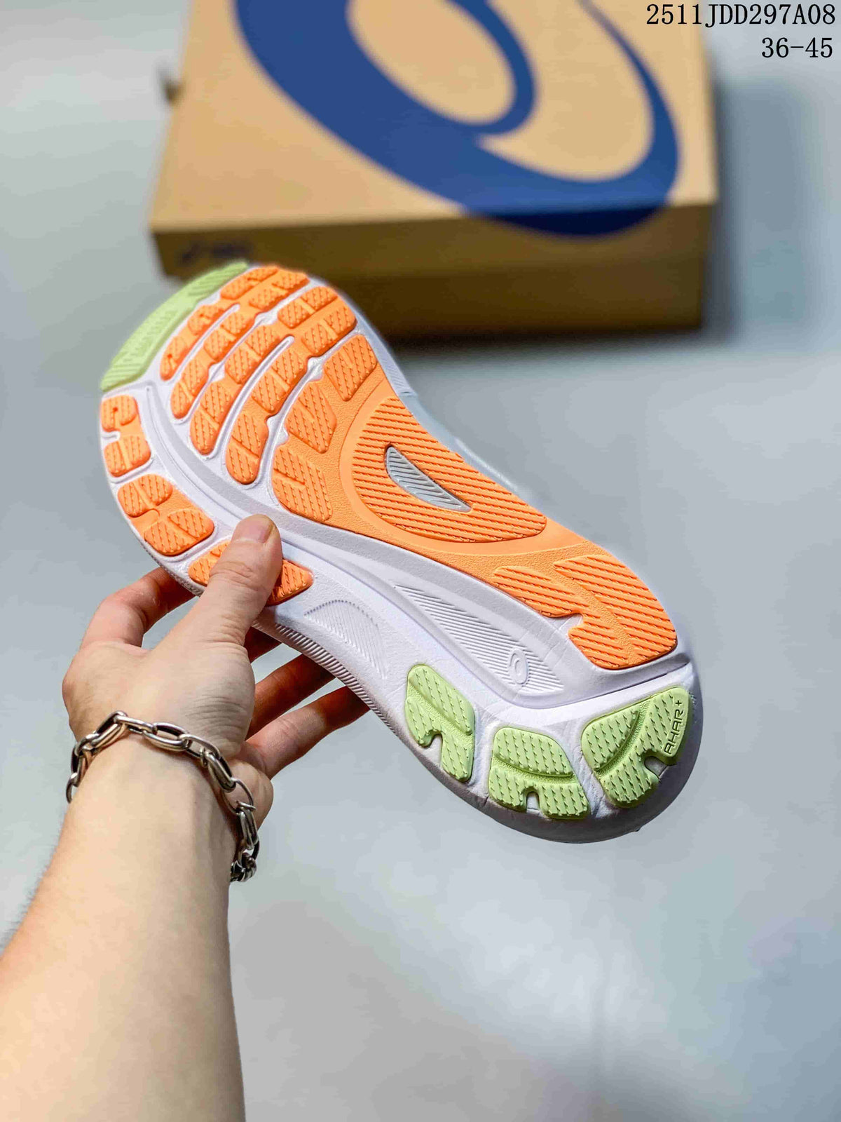 Close-up of the shoe outsole with orange, white, and lime sections.