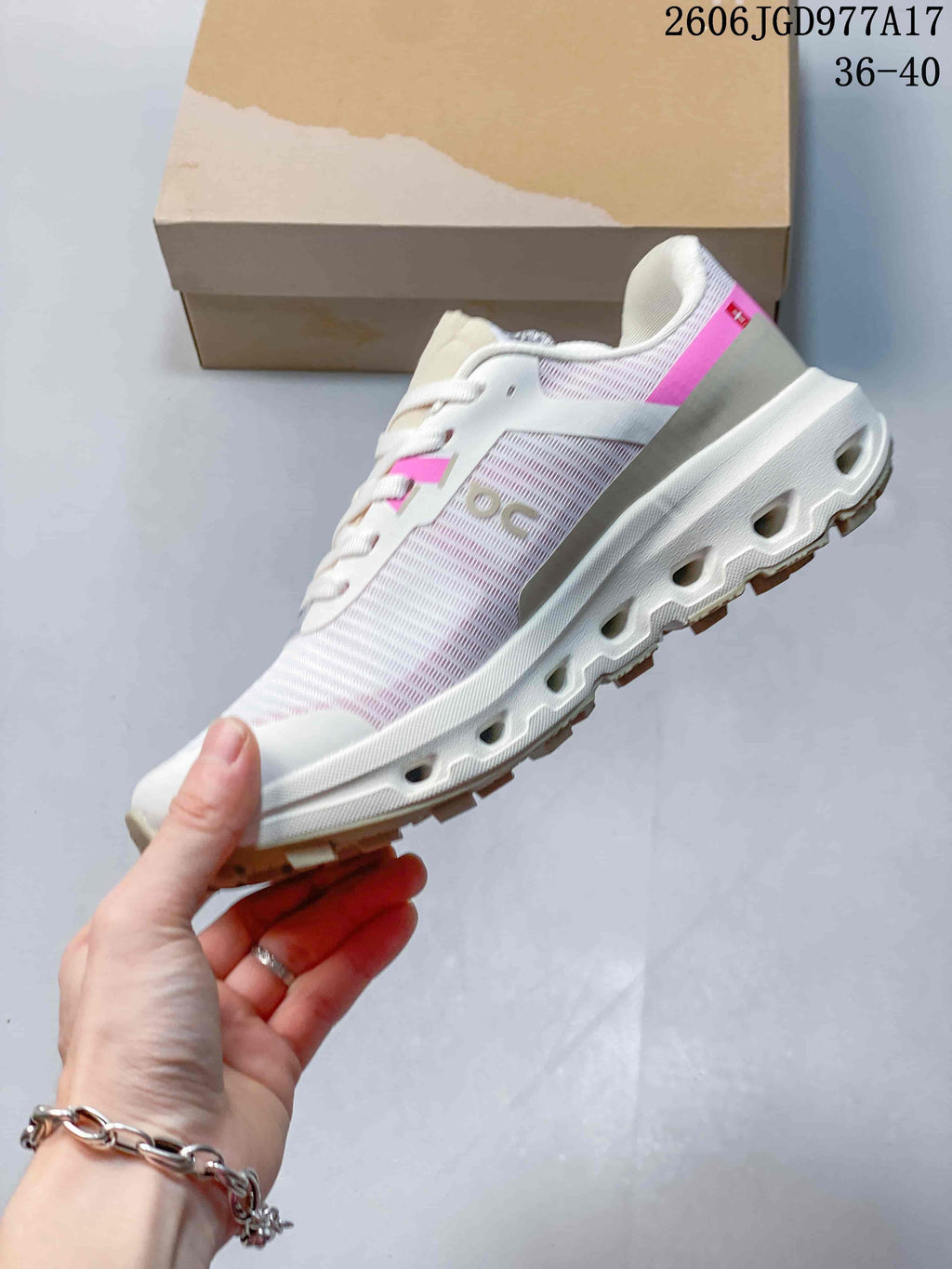 Side view of a white and pink On Cloudvista 2 shoe.