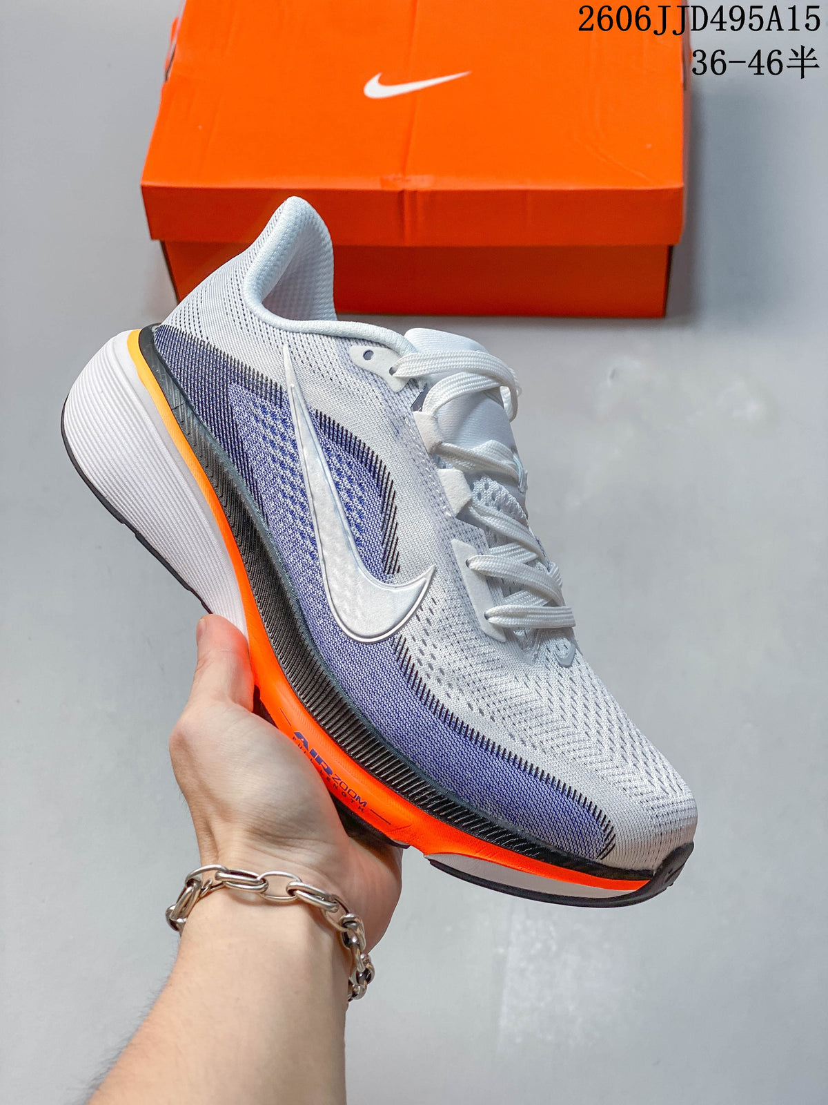 White Nike Air Zoom Pegasus 42 shoe with purple side details and bright orange sole accents