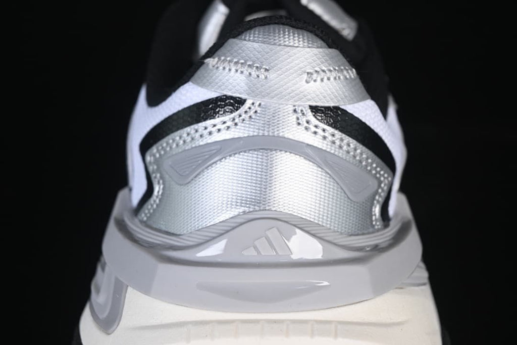 Rear view showing silver heel details and sculpted midsole