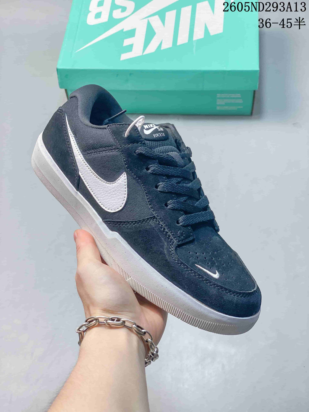Dark navy Nike SB Force 58 low-top sneaker with a white Swoosh