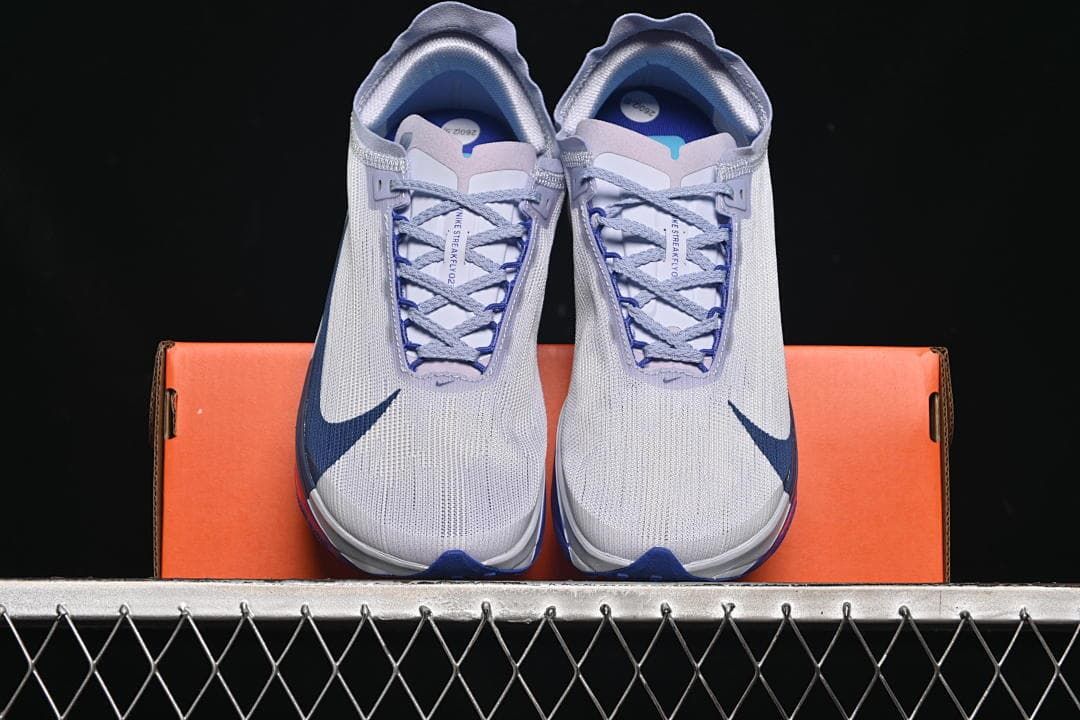 Front view of the pair resting on the orange shoe box.