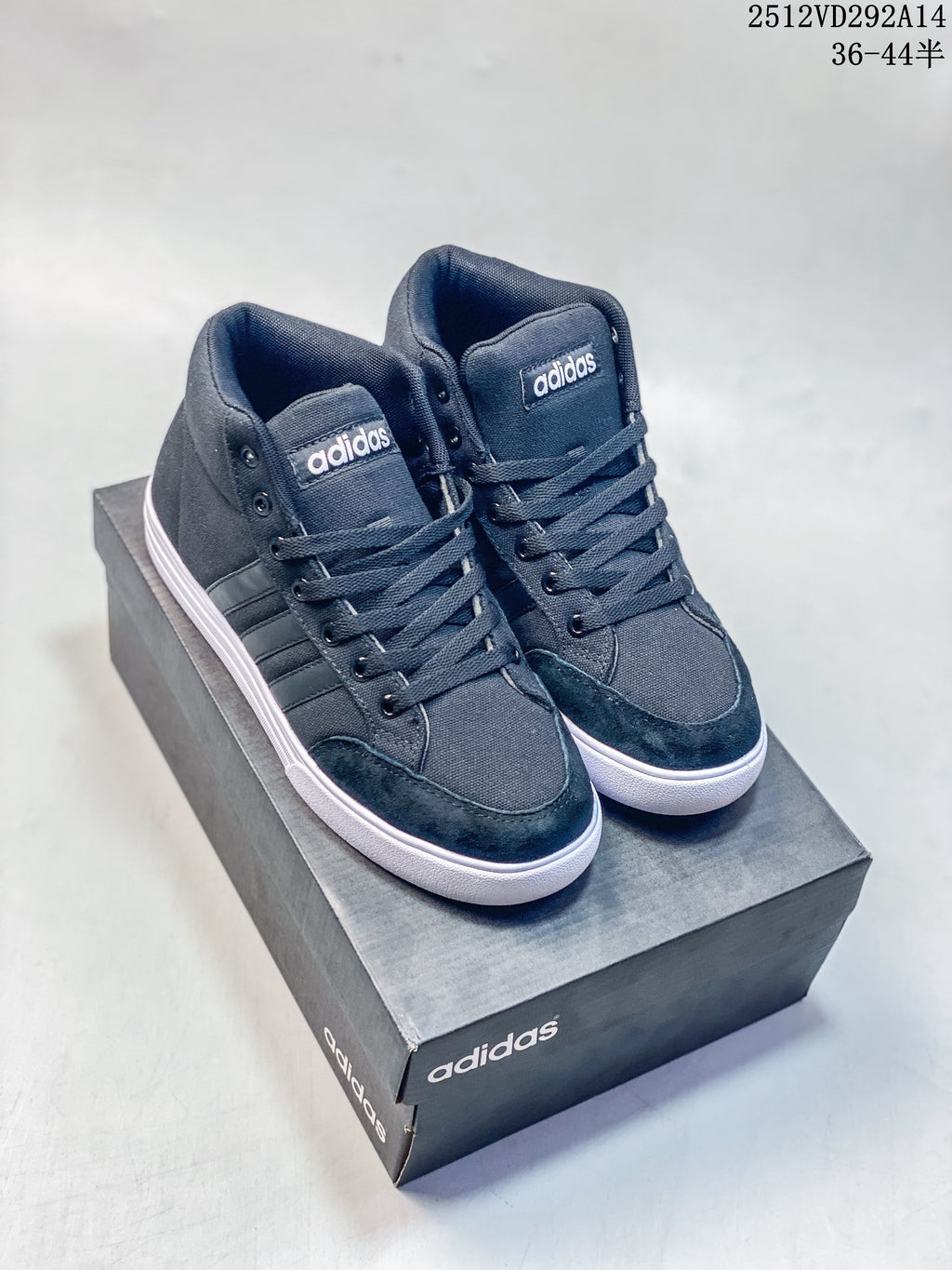 Pair of dark Adidas VS Set Mid high-top sneakers with white soles, shown from the front at an angle.