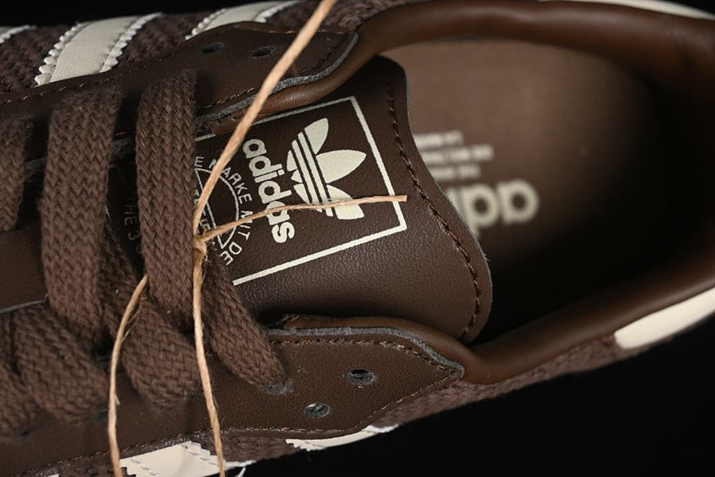 Close-up of the tongue branding and brown laces