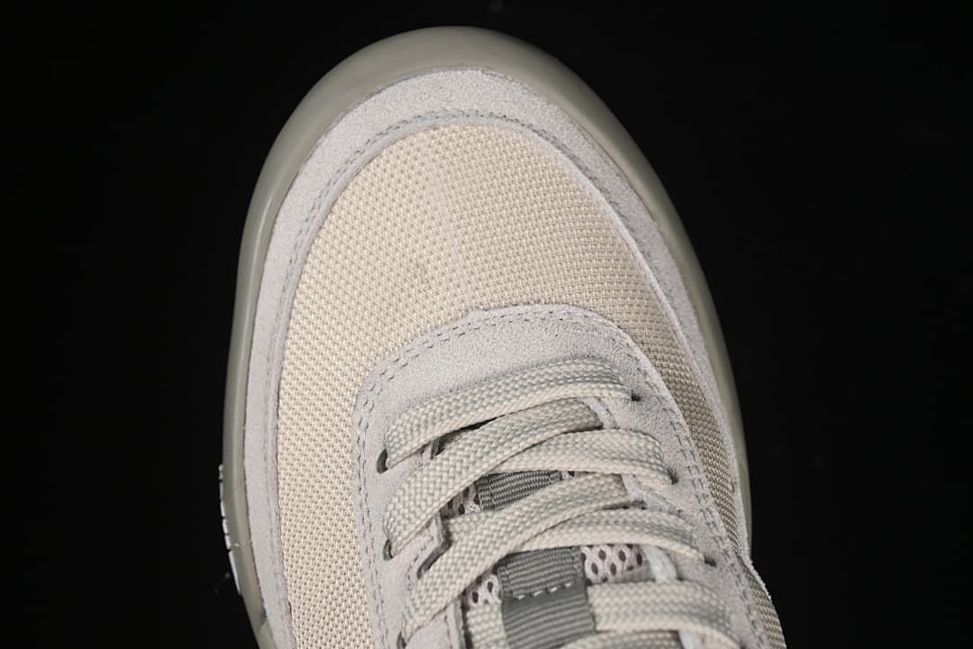 Top-down close-up of the mesh-look toe and lacing