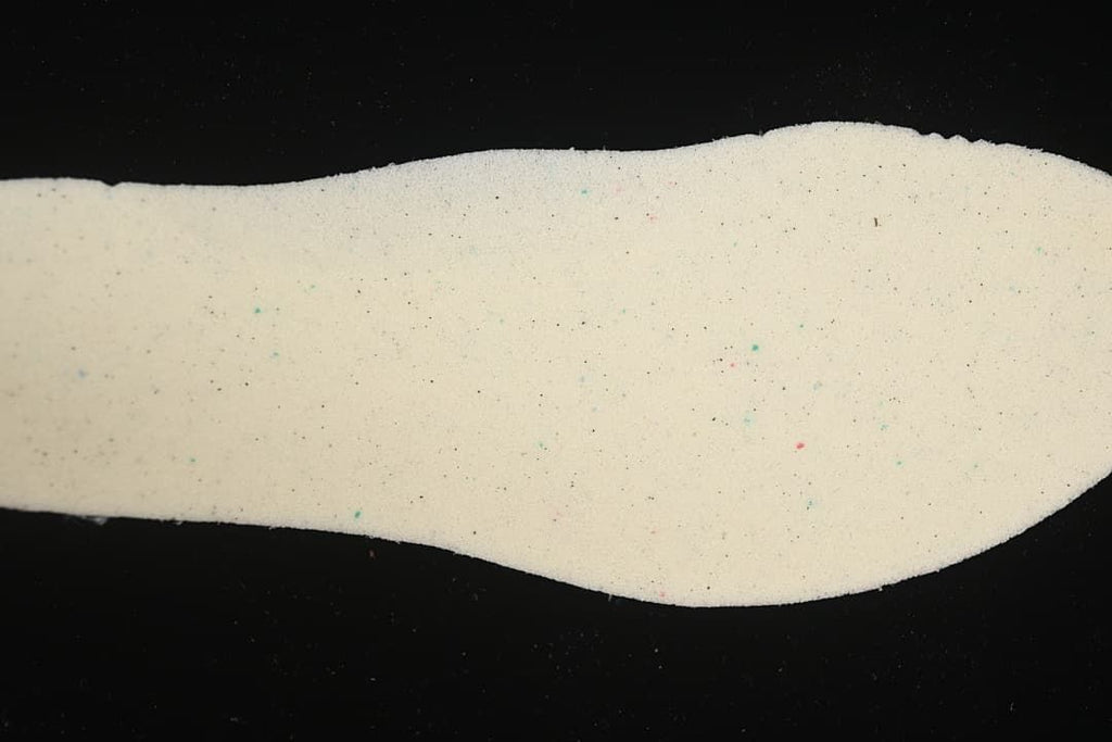 Light-colored shoe insole shown from above.
