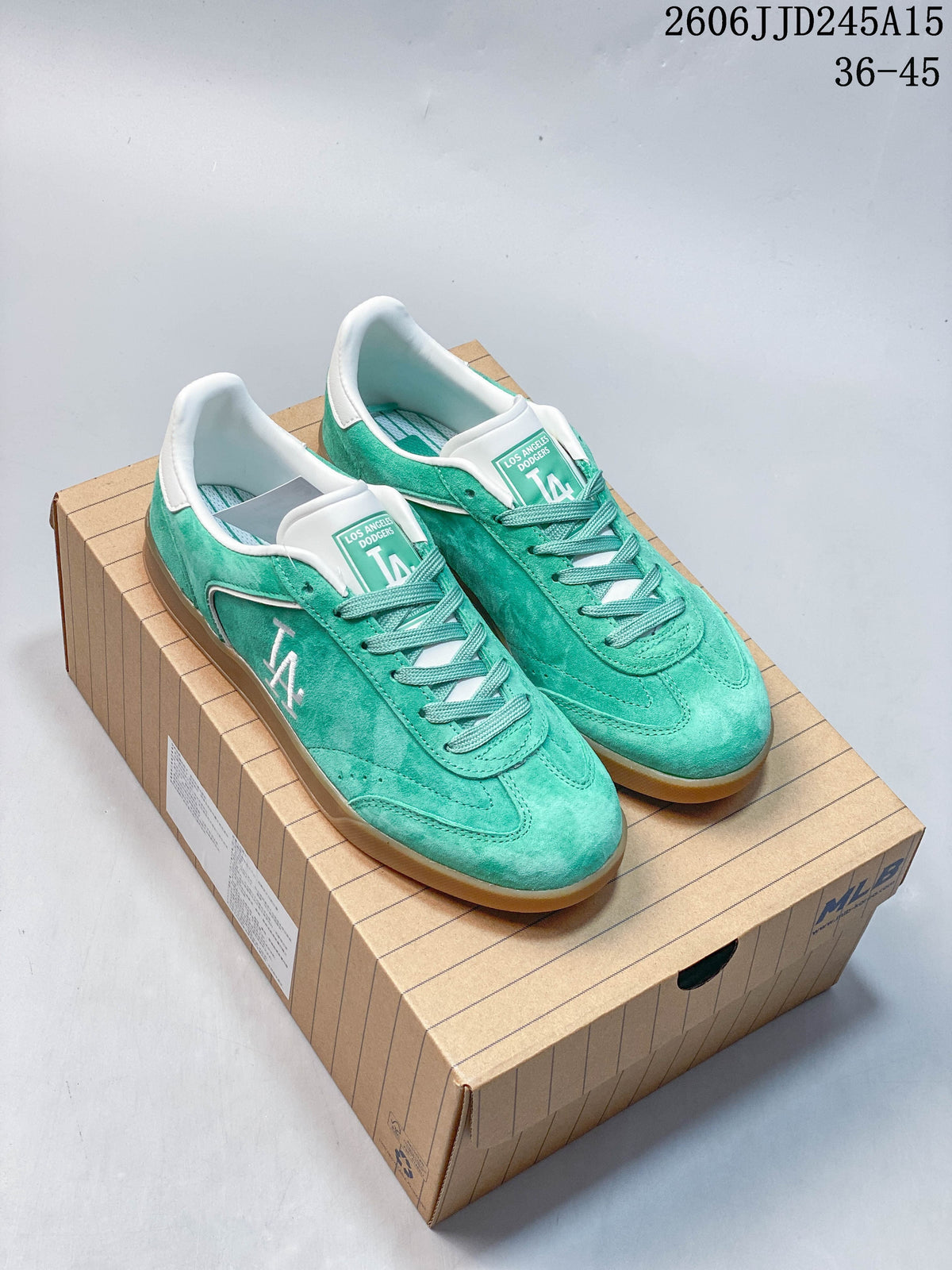 Pair of teal Los Angeles Dodgers low-top sneakers with white accents and gum-colored soles, shown on a box.