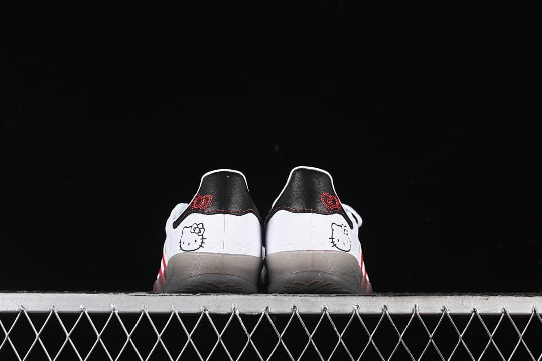 Rear view of both shoes showing Hello Kitty heel graphics and black heel tabs.