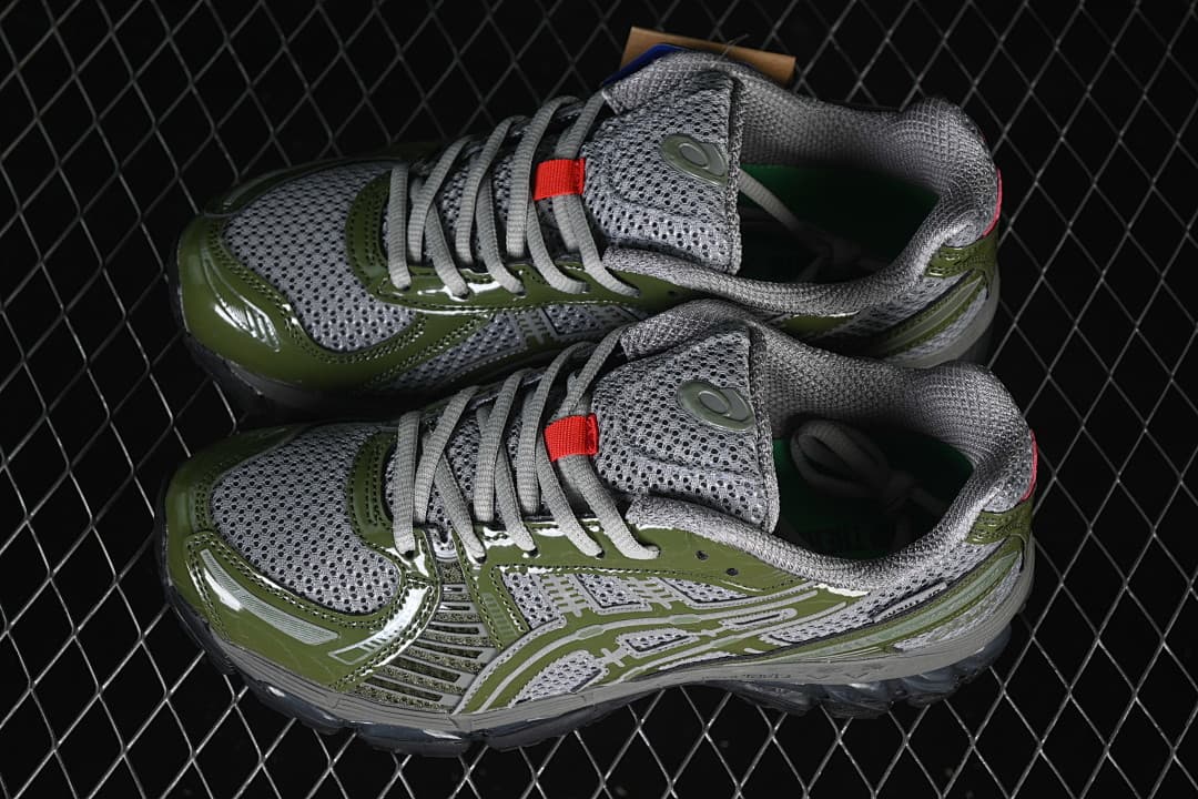 Pair of gray and olive-green ASICS sneakers shown from above.