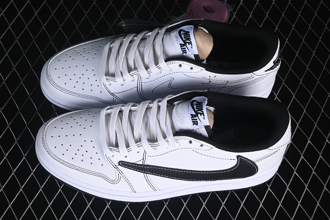 Pair of white low-top sneakers with black details, shown from above.