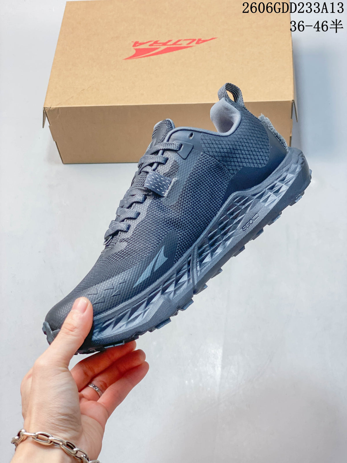 Side view of the dark gray-blue Altra Timp 5 trail shoe