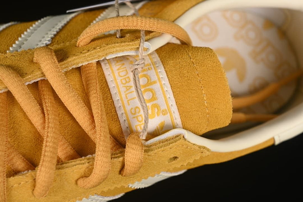 Close-up of the tongue label and yellow laces
