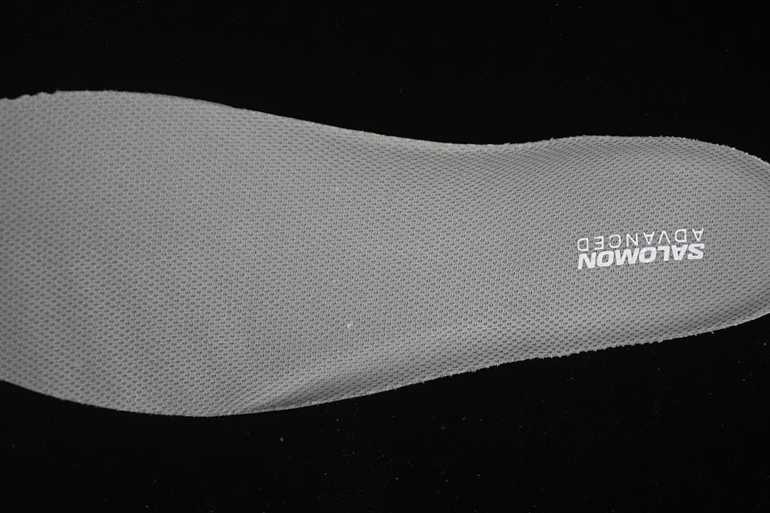 Close-up of the gray Salomon Advanced insole branding.