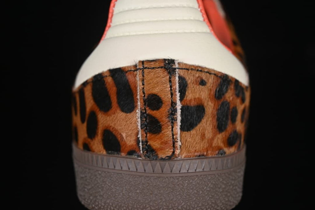 Rear view showing the leopard-print heel panel, cream heel tab, and brown outsole