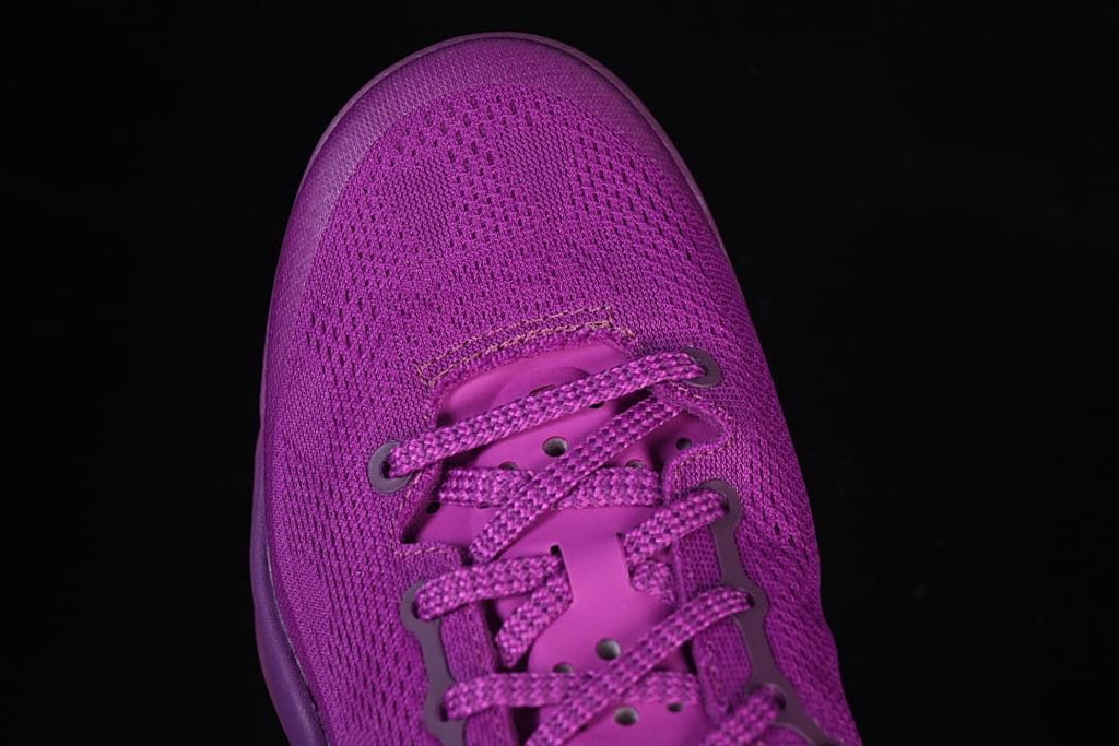 Top-down close-up of the purple mesh toe and laces