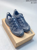 Dark gray Salomon XA Pro 3D trail running shoes shown from above on a branded box