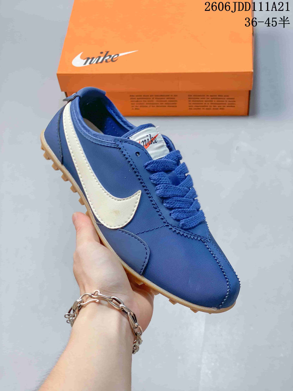 Blue Nike Moon Shoe OG Summit low-top sneaker with a white Swoosh and gum-colored outsole