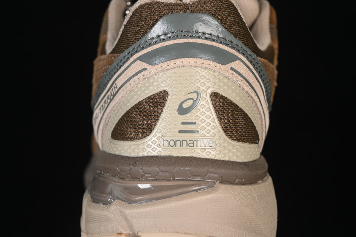 Close-up of the heel branding and layered rear construction.