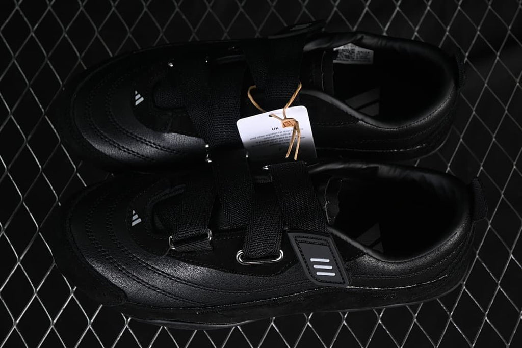 Pair of black sneakers shown from above
