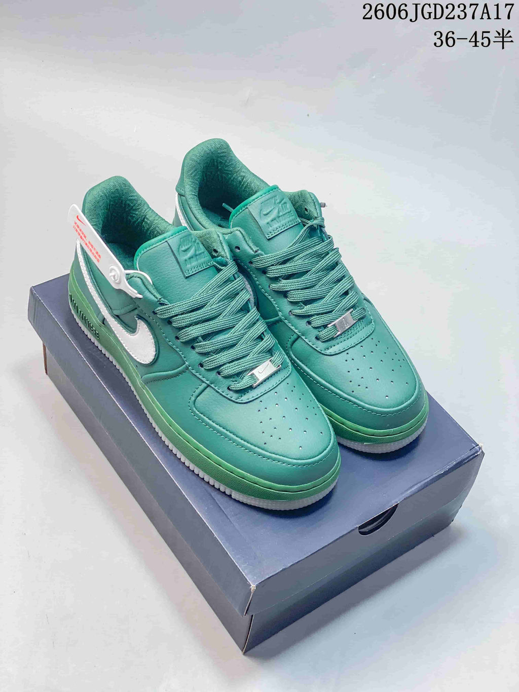 Teal Nike Air Force 1-style low-top sneakers with white Swooshes, pictured on a shoe box; image overlay states 36–45.5.