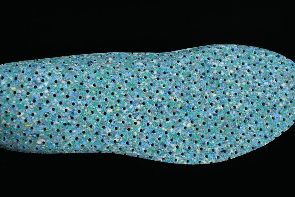 Close-up view of a blue-green patterned shoe insole.