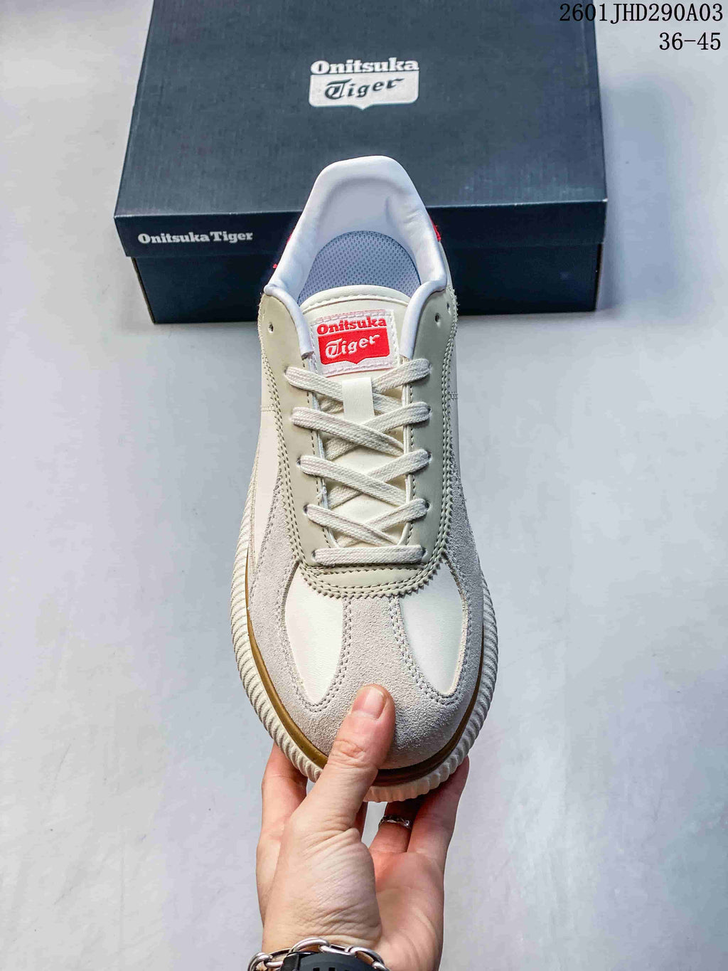 Top view of the lace-up sneaker showing its tongue label and cream-colored panels