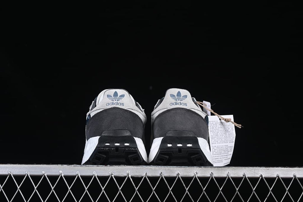 Rear view of the pair showing heel panels and outsole details