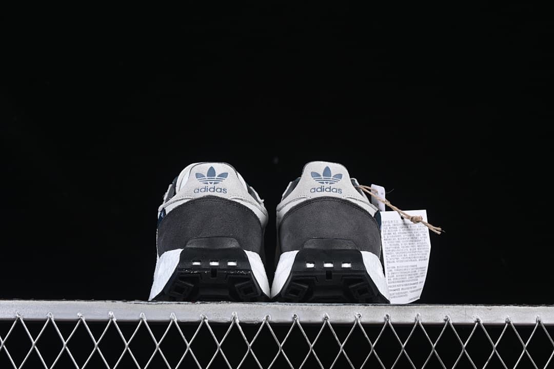 Rear view of the pair showing heel panels and outsole details