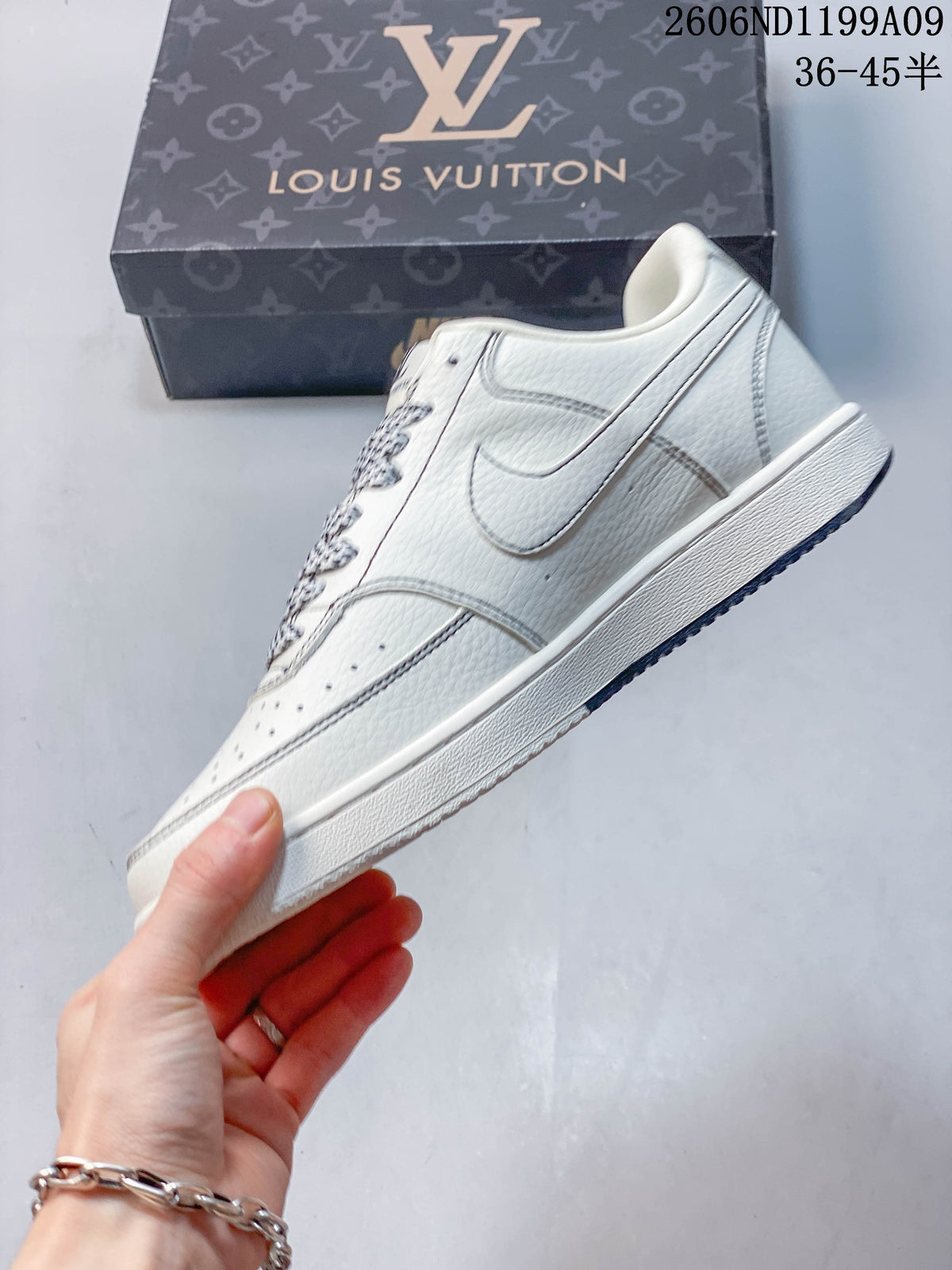 Side view of the off-white low-top sneaker with a small Swoosh detail