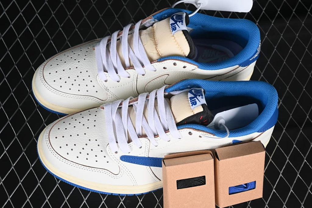 Pair of off-white and blue low-top sneakers with spare lace boxes
