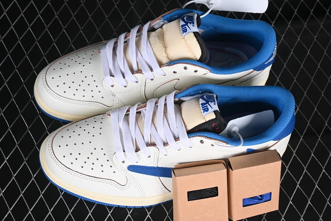 Pair of off-white and blue low-top sneakers with spare lace boxes