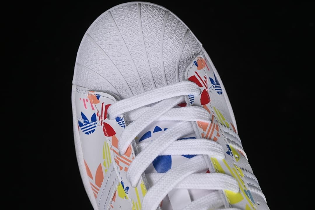 Top view of the shell toe, laces, and colorful graphic panels