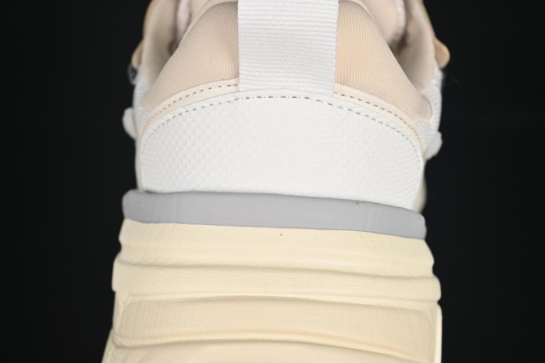Rear view of the sneaker showing the heel pull tab and layered sole