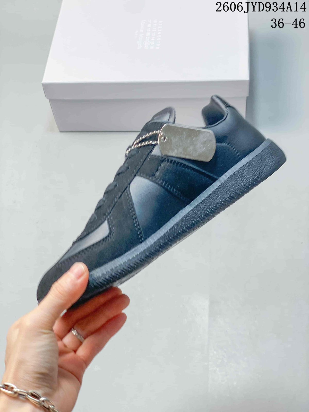 Side view of a dark navy low-top sneaker with a lace-up front