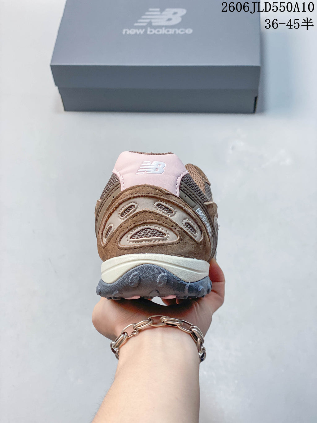 Rear view of a New Balance 204L sneaker showing its layered heel panels