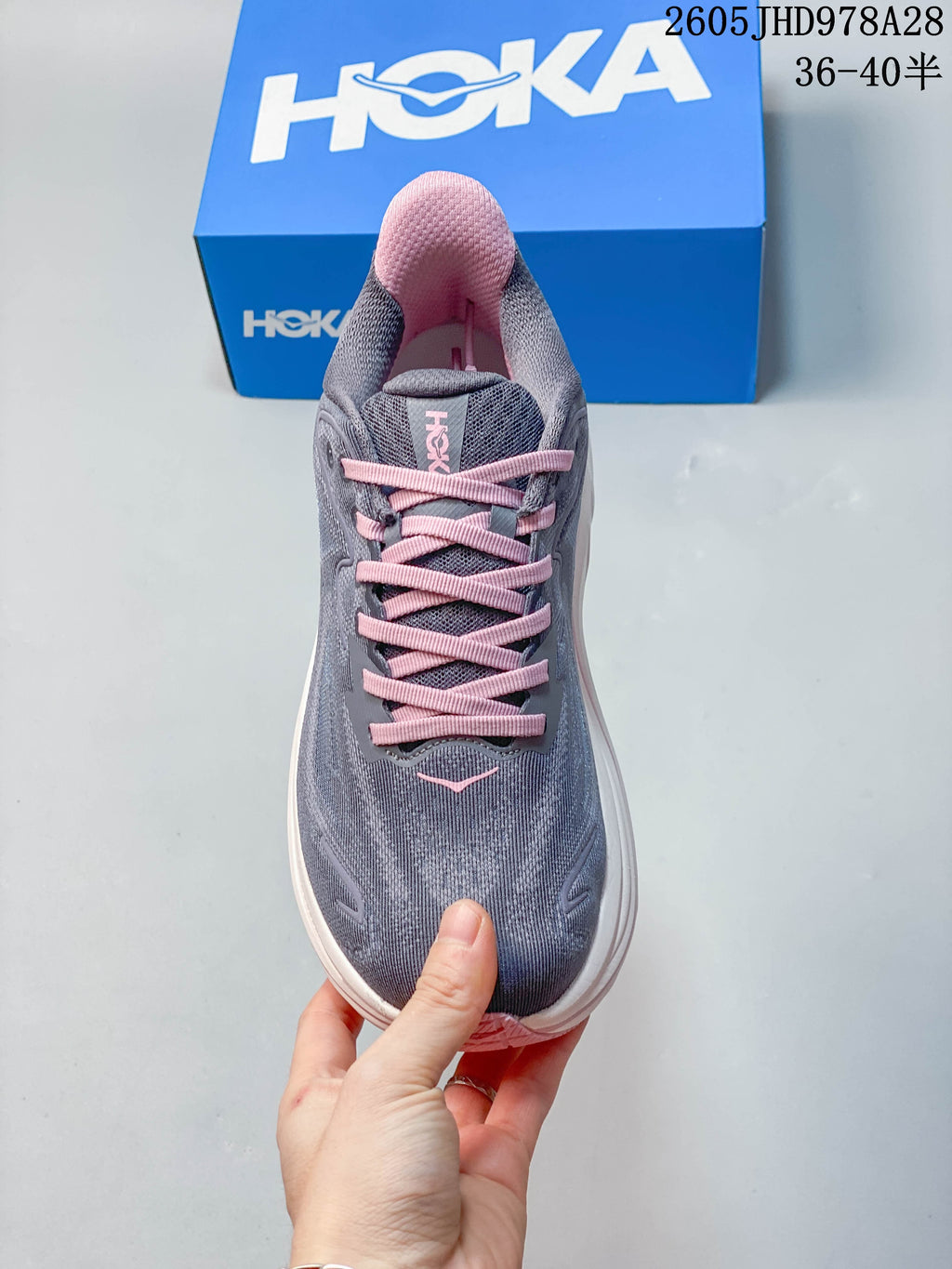 Top view of a gray HOKA Clifton 10 running shoe with pink laces