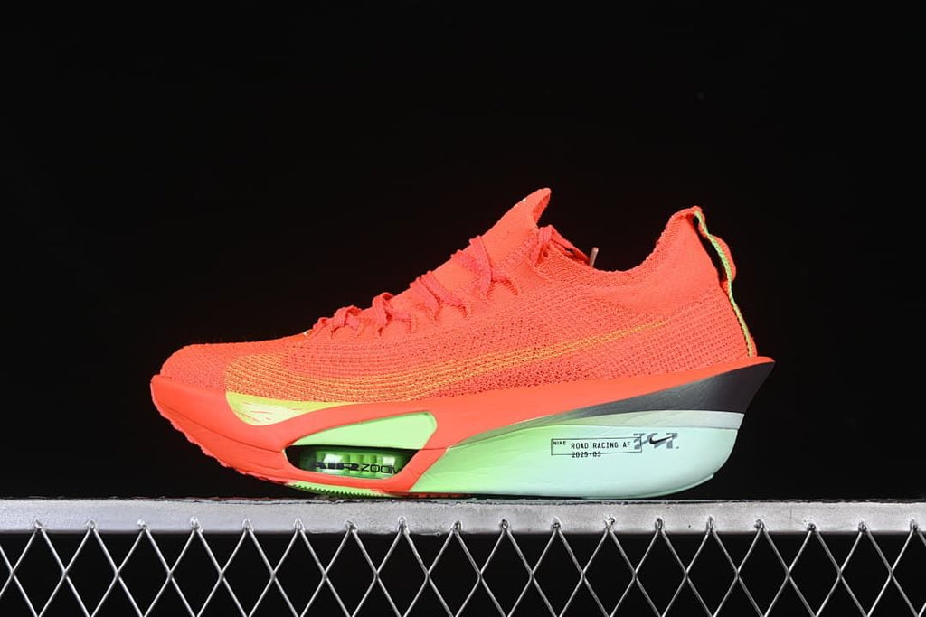Side view of a bright-crimson Nike Alphafly 3 shoe with lime accents and pale mint midsole.