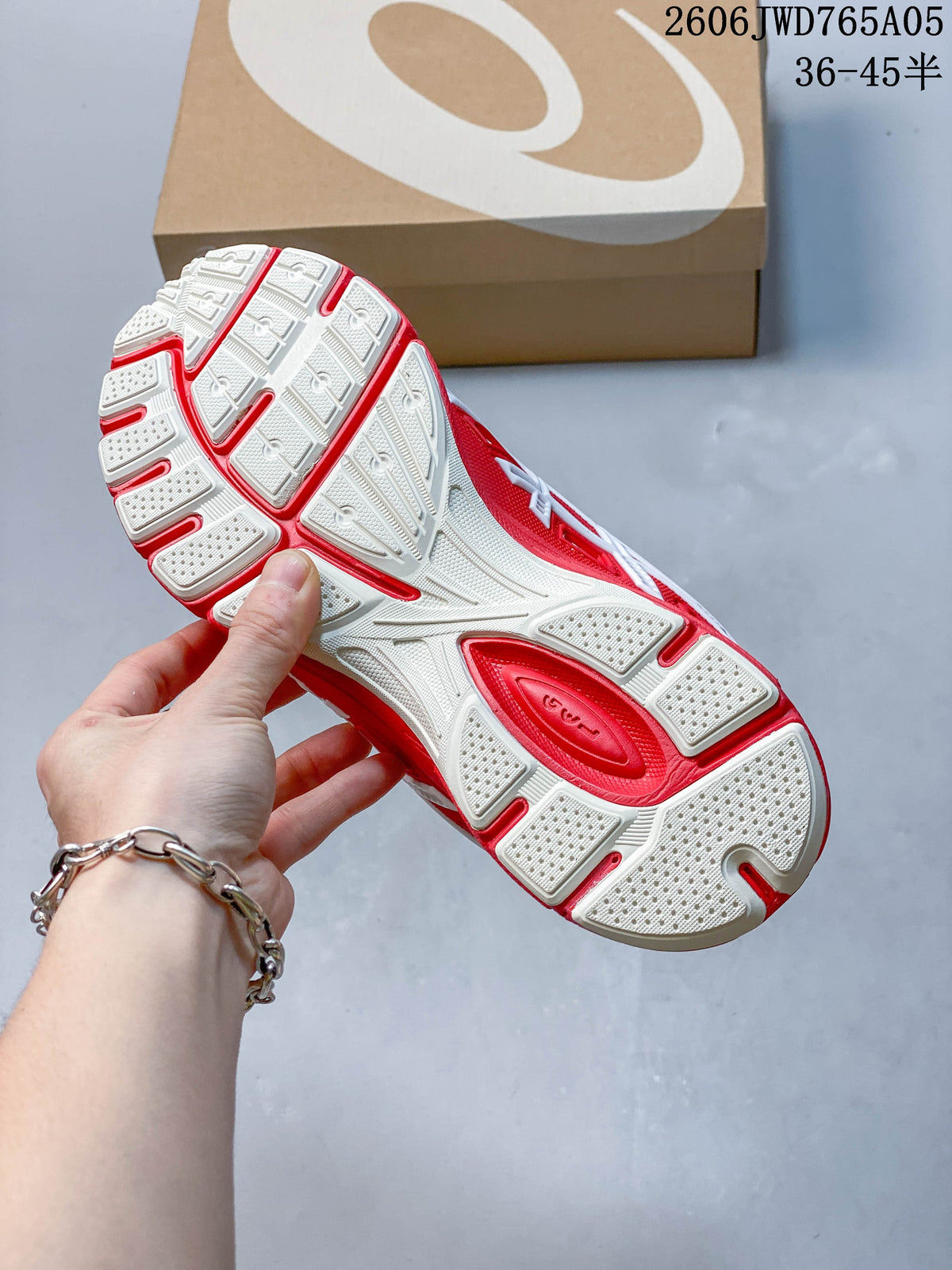 Outsole view of the white and red ASICS Gel-TRUCK sneaker