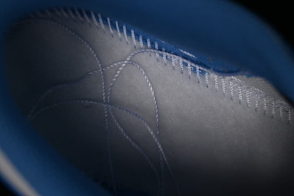 Interior stitching and lining detail of the sneaker.