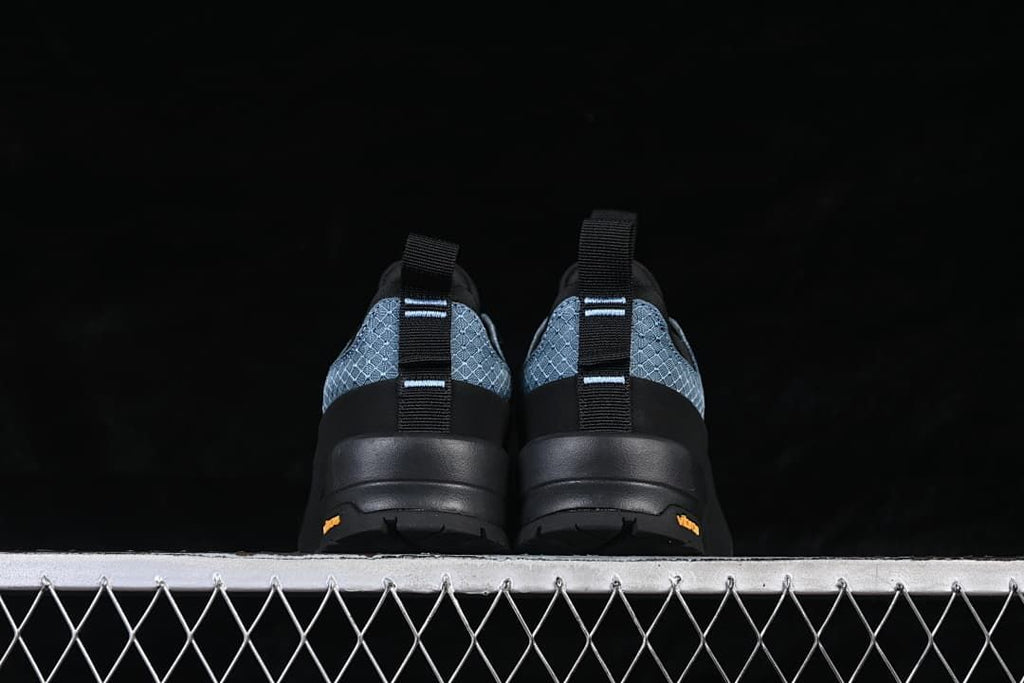 Rear view of the pair showing heel pull tabs and outsole branding.