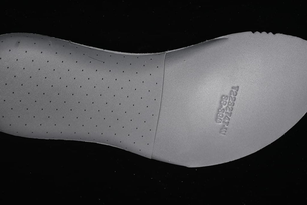 Close-up of the sneaker outsole with perforated detailing